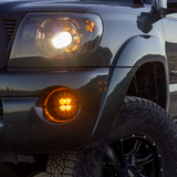 amber led fog light kit mounted on a toyota tacoma